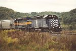 Westbound manifest eases down the siding